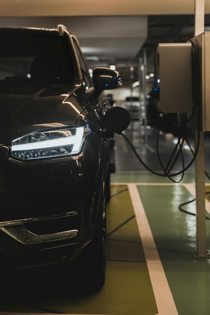 pexels photo 11554746 11554746 Luxury electric car charging at a station in Curitiba parking garage.